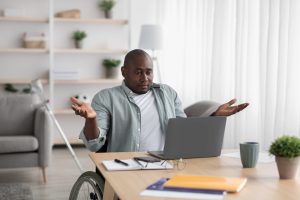 man in wheelchair confused about online marketing mistakes