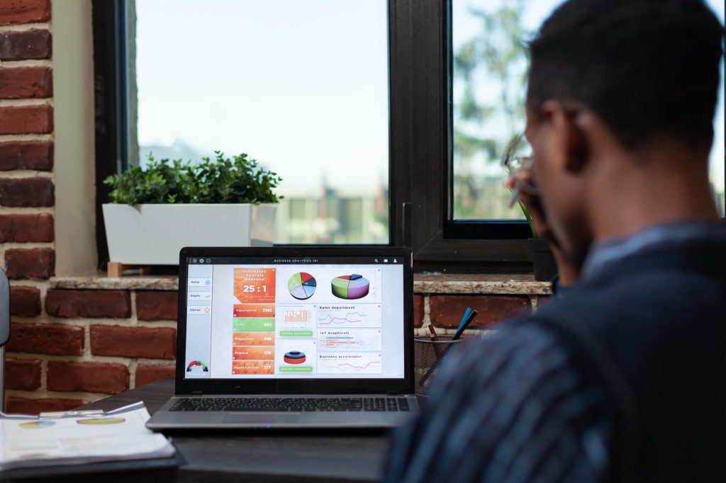 A man in suit monitoring his online marketing campaign